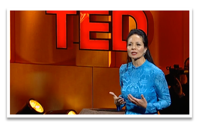 Dr. Elizabeth Lindsey speaking on a TED stage
